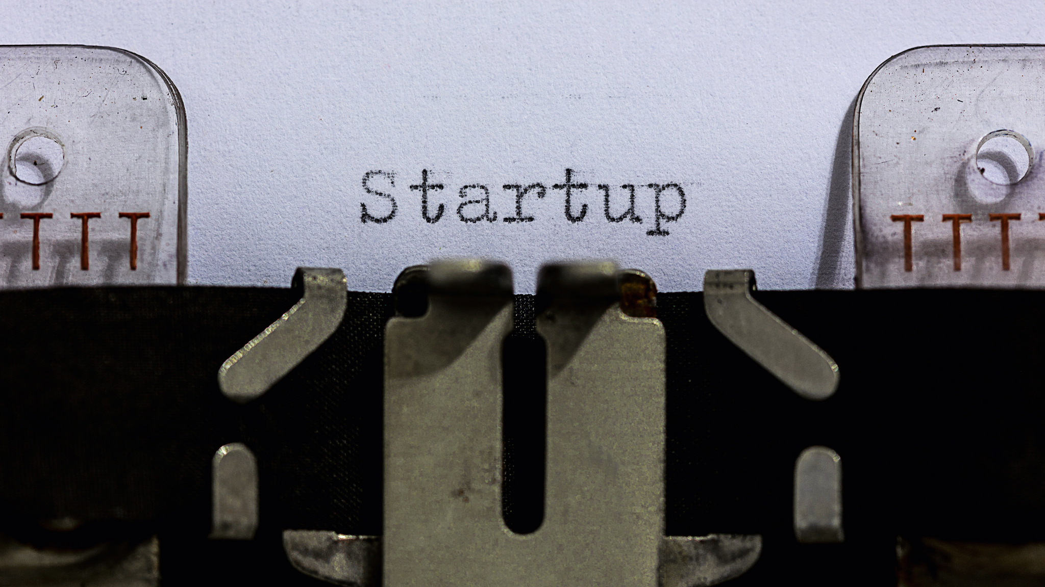 A typewriter with the word "startup" spelled out, published as part of "Building a Startup? Why Lean UX Is Your Best Friend"