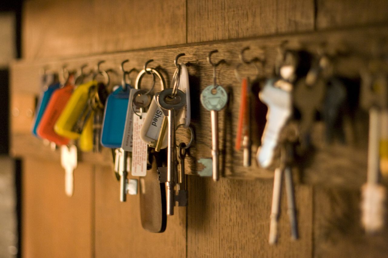 A photo of keys hanging on a wooden wall, published as part of 