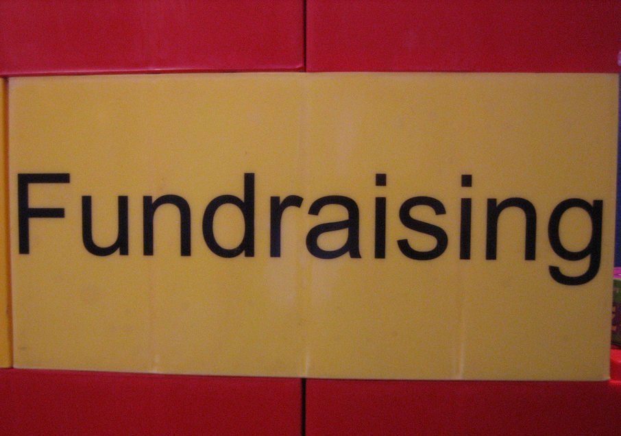 A yellow and red sign that says "fundraising," published to "3 Digital Marketing Tools for Non-Profits"