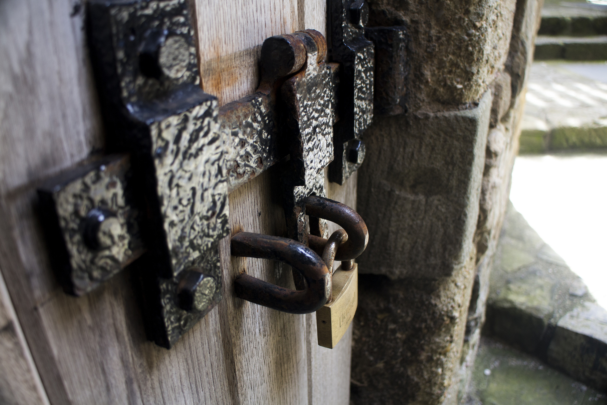 A padlock on an an old wooden door, published to: 