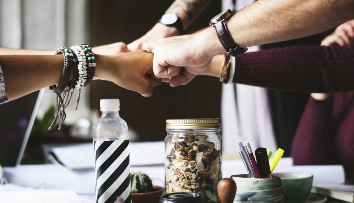 A photo of several hands fist-bumping, published to: 